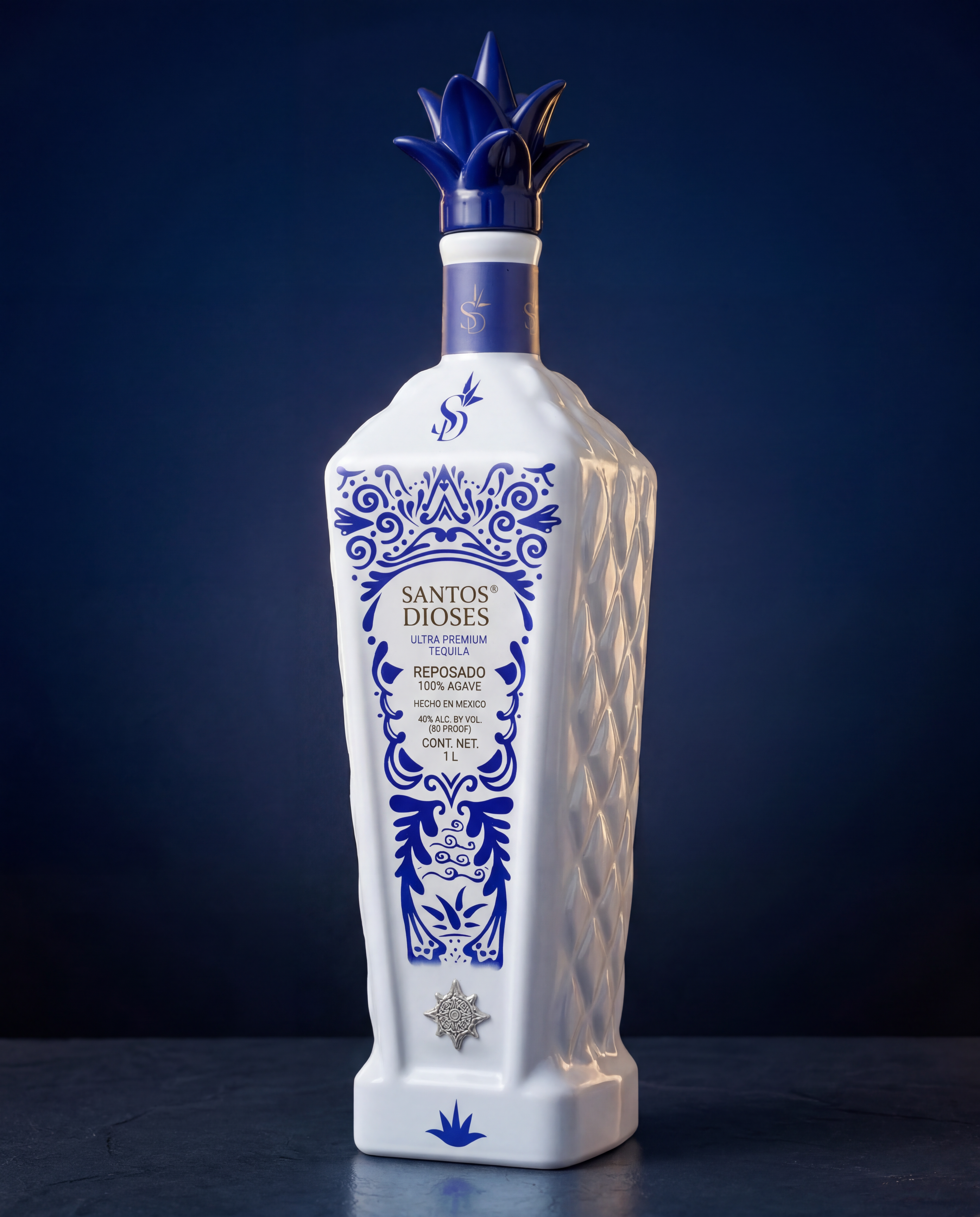Santos Dioses Reposado bottle fully lit at 3/4 angle on a deep cobalt-blue gradient background with a dark stone surface, diamond-quilted side panel visible on the right edge